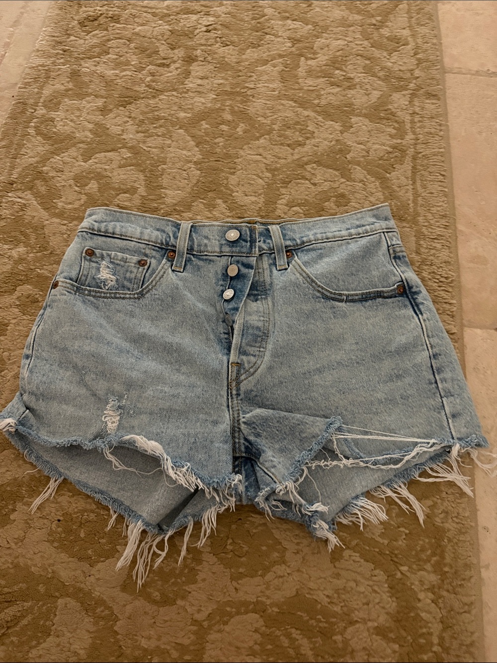 Levi’s 501 Light Blue Distressed Denim Shorts